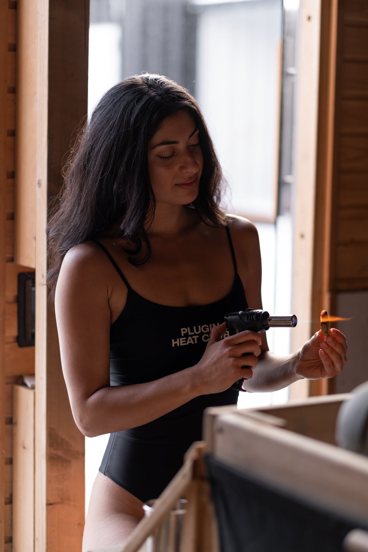A trained Plugin Heat Club facilitator carrying sauna cups