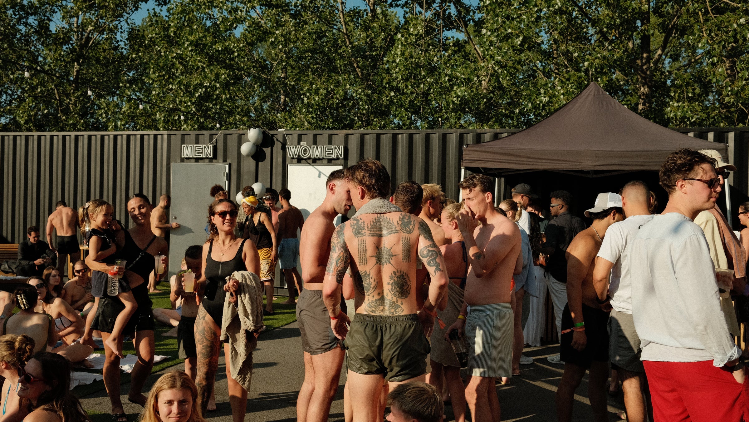 Two guests embracing at a Plugin Heat Club event